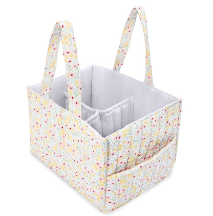 Fabric storage caddy with floral handles on a white background