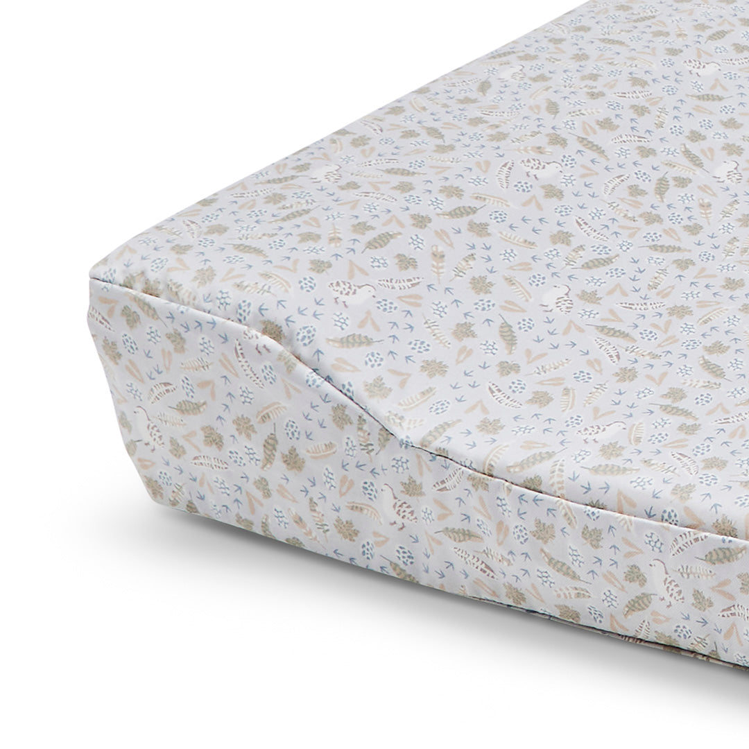 Floral patterned mattress cover on a white background