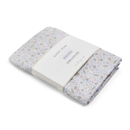 Floral-patterned fabric with a brand label on a white background