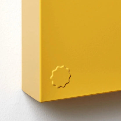 Yellow box with a circular logo on a white background