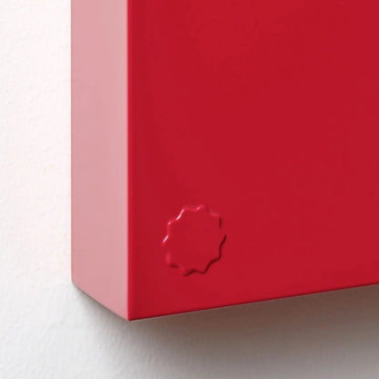 Close-up of a red box with a brand logo on a white background