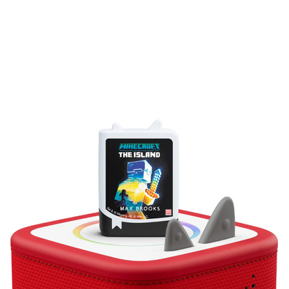 Book titled 'Minecraft: The Island' by Max Brooks on a red and white platform with shark fins.
