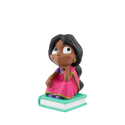 Figurine of a character in a pink outfit sitting on a book with a white background