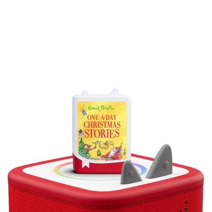 Red toy with a book titled 'One-A-Day Christmas Stories' on a white background