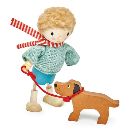 Wooden toy figure of a boy with a red and white striped scarf and a wooden dog on a white background