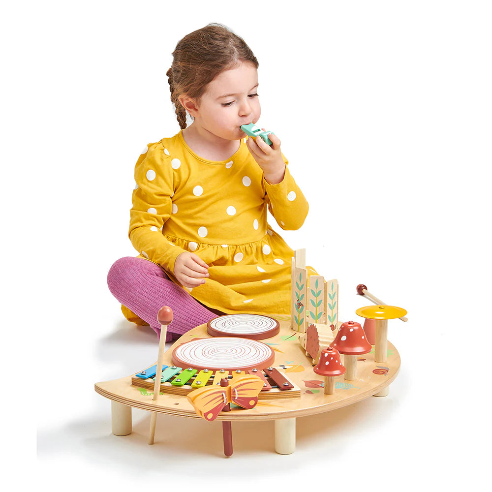 Child playing with a wooden toy set on a white background