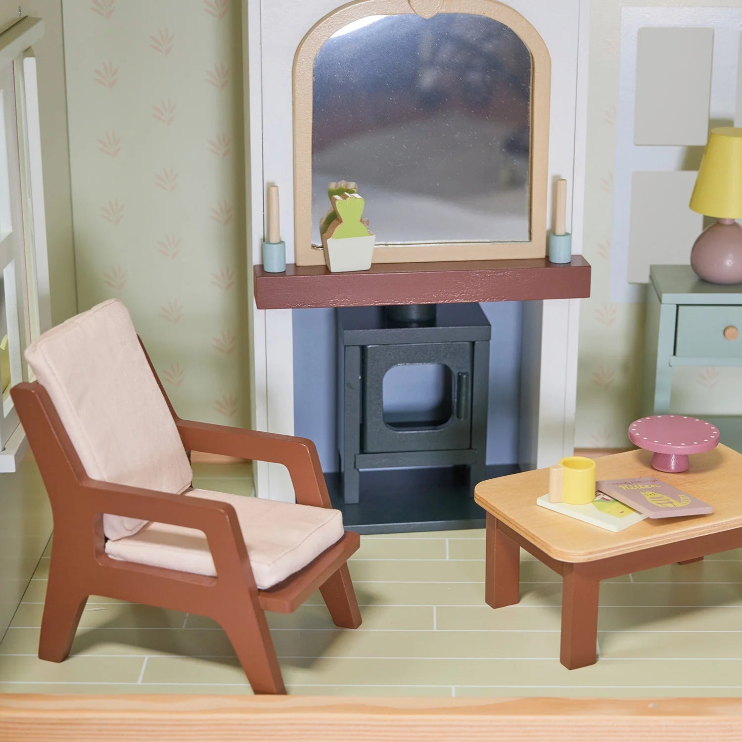 Miniature living room setup with furniture and decor.