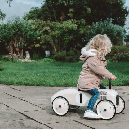 Ride on car with number 1 on the side with child riding on it