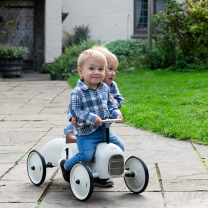Ride on car with number 1 on the side with children riding on it