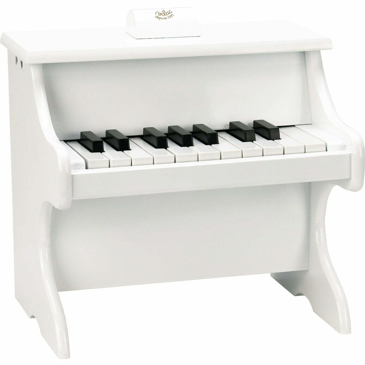 White wooden toy piano on back background
