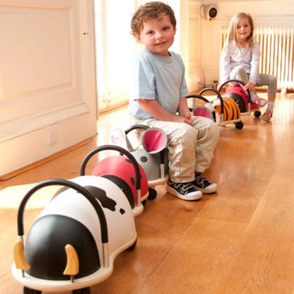 Lots of ride on toys with 2 children 