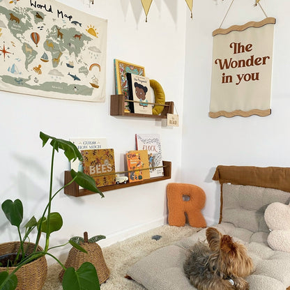 Children's room with world map, books, and decorative elements.