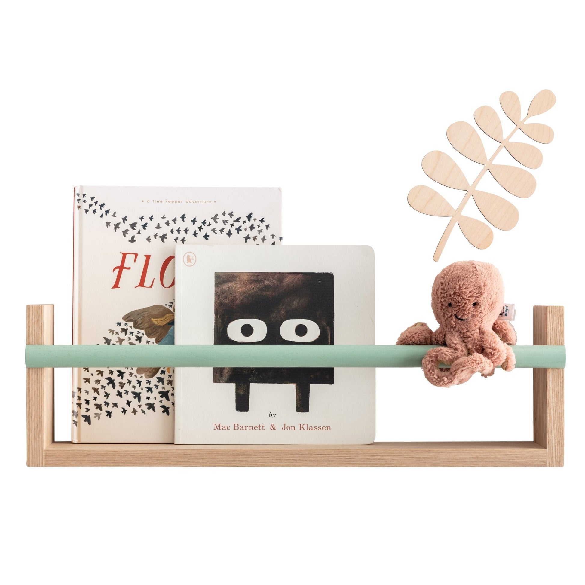 Wooden shelf with books and a plush toy on a white background