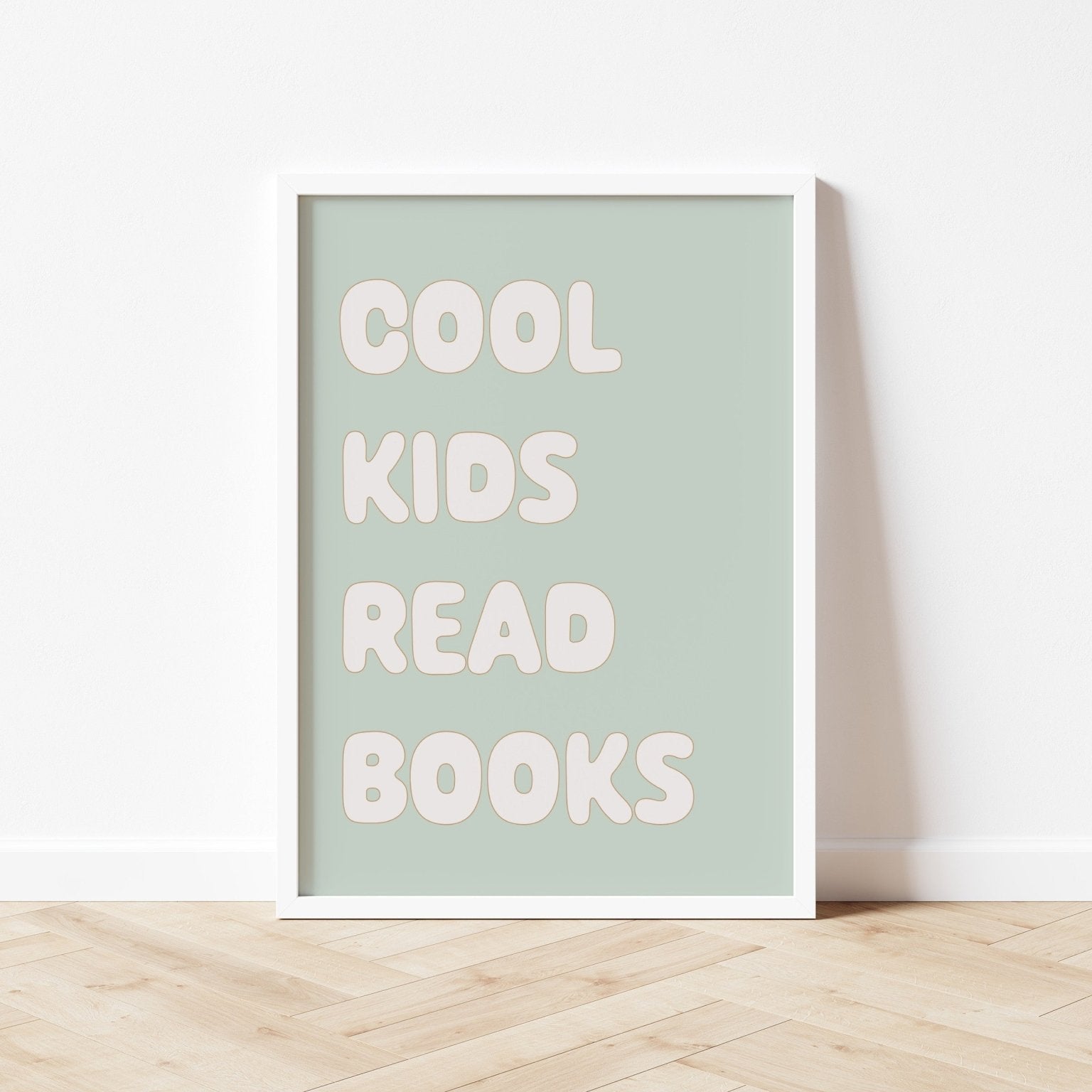 Framed poster with 'Cool kids read books' text on a light green background