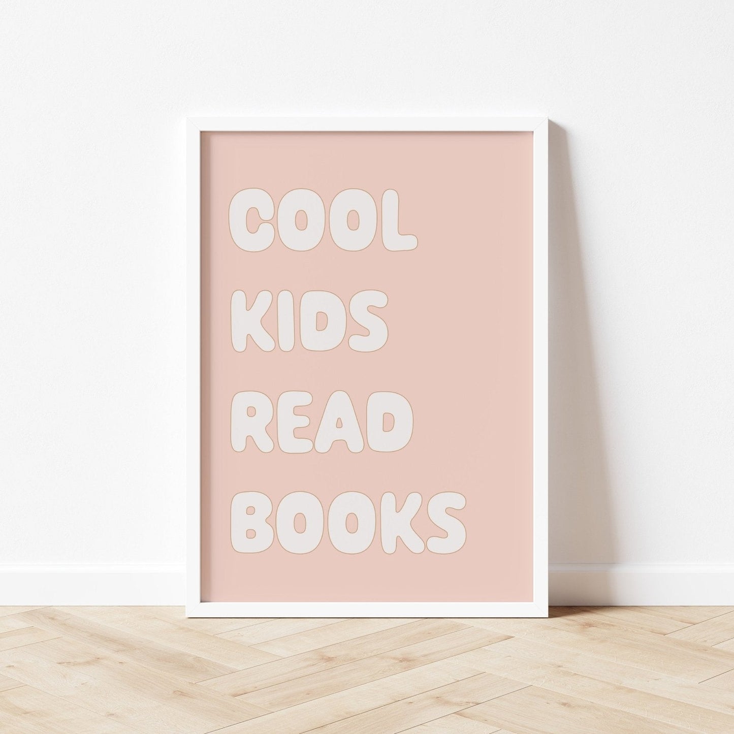 Poster with 'Cool kids read books' text on a pink background