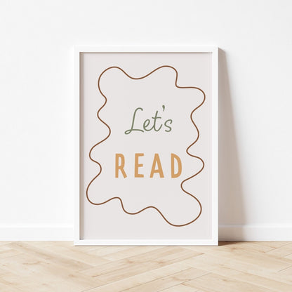 Framed poster with 'Let's Read' text on a white wall.