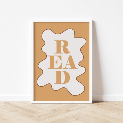 Decorative wall art with 'READ' text on a wooden surface and white wall background