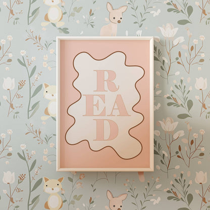 Framed pink sign with 'READ' on a floral and animal wallpaper background