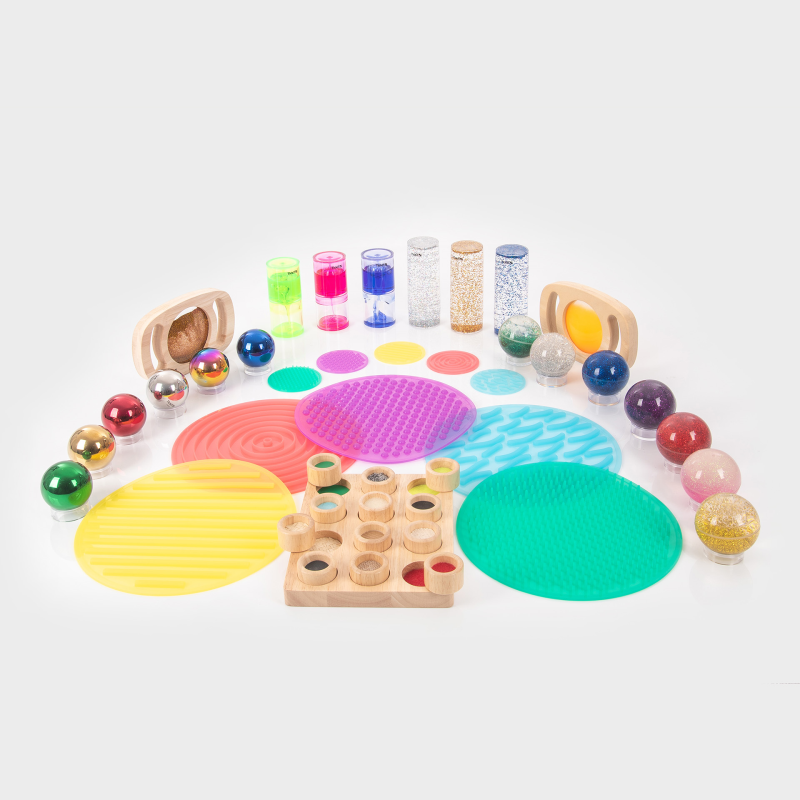 Assorted colourful sensory toys on a white background