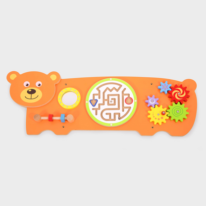 Colourful children's toy with a bear design on an orange background wall panel with educational toys.