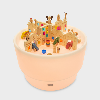 Toy building set on a sensory light table