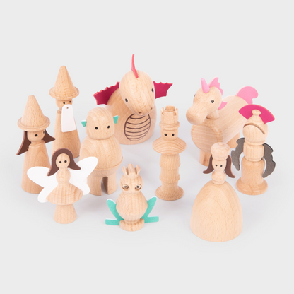 Set of wooden castle figurines on a white background