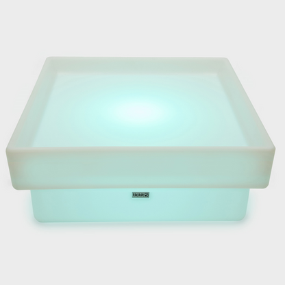 Sensory table glowing blue.