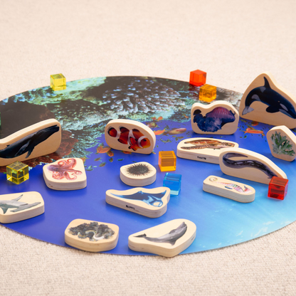 Wooden animal figures on a play mat