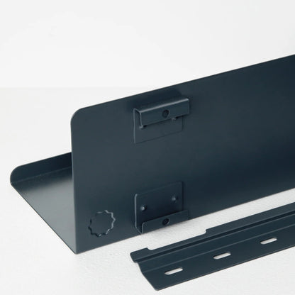 Black metal brackets on a white background