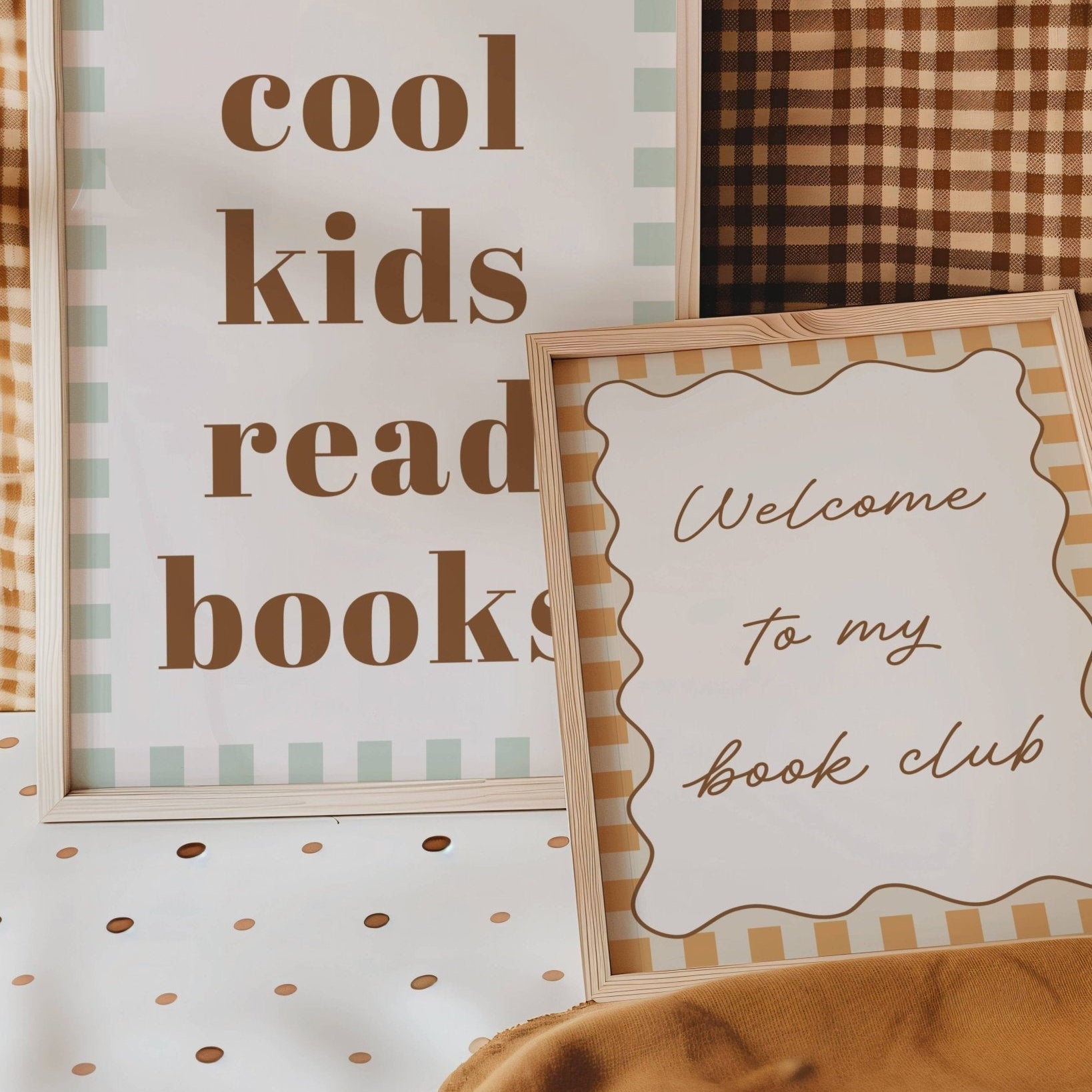 Two framed signs on a checkered fabric background, one saying 'cool kids read books' and the other 'Welcome to my book club'.
