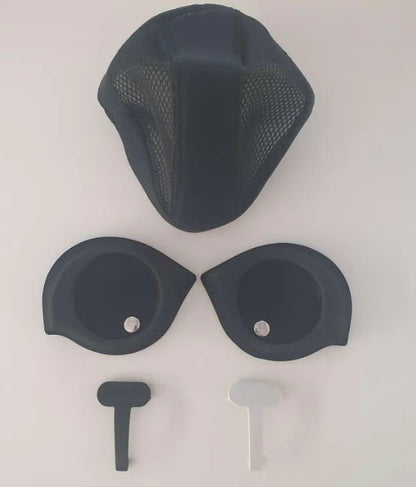 Set of black motorcycle helmet parts on a white background